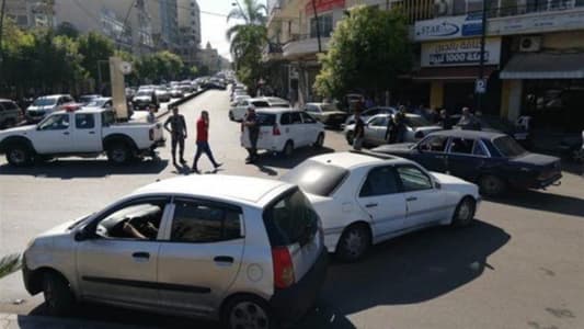 Public car owners block the road in Nejmeh Square in Sidon due to high fuel prices