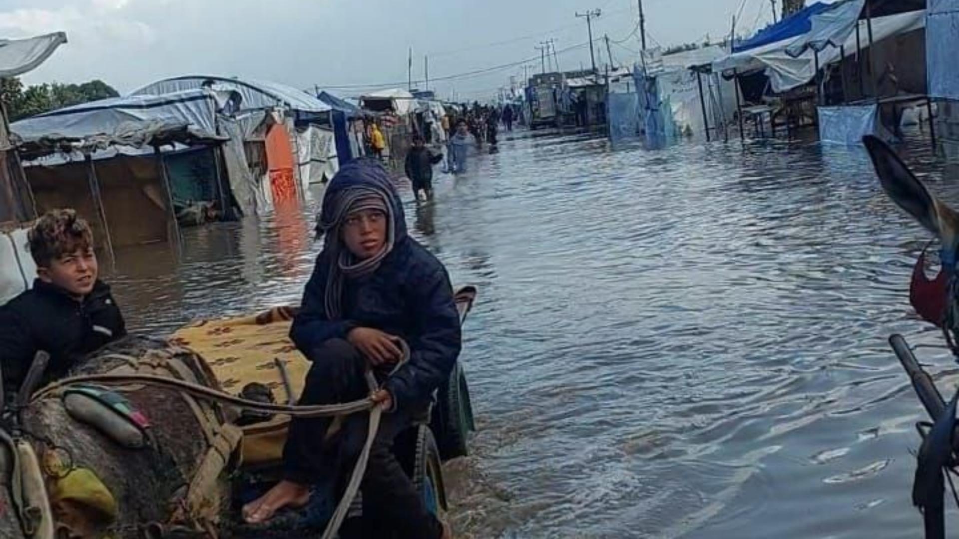 Photos: Storm turns camps into swamps