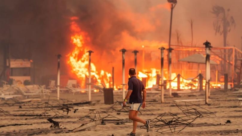 Firemen fighting wildfires in Sicilian town of Catania