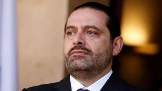 Hariri in front of his father's tomb, the martyr Rafik Hariri: May God help Lebanon