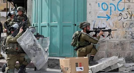 Israeli troops kill three Palestinians in West Bank raid, medics say