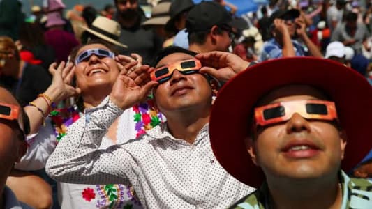 North Americans Celebrate Total Solar Eclipse with Cheers and Music