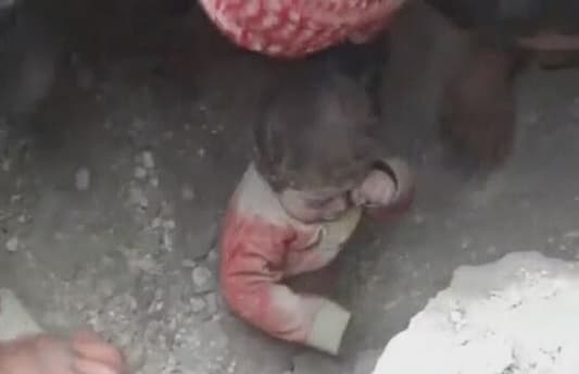 In video: Boy pulled out alive from under rubble in Aleppo