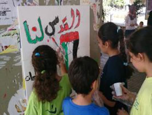 رسوم جدارية في بئر العبد تحية لأطفال غزة