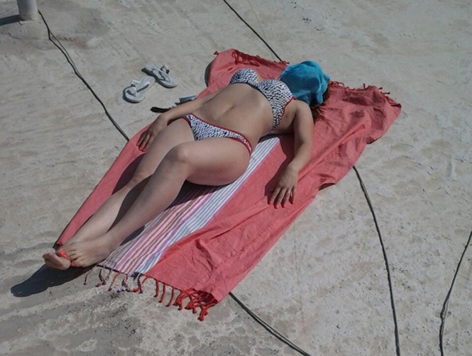 Lying Half-Naked on a Roof, to Save Money