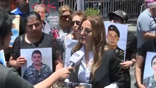 Families of the victims of the Beirut port explosion burn tires outside the Palace of Justice demanding to complete investigations and to remind the judiciary to fulfill its duties