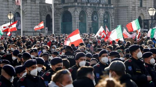 Tens of thousands march in Vienna against COVID measures before lockdown