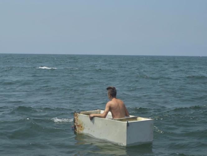 Footage: Guy Spotted Riding Waves in A Fridge