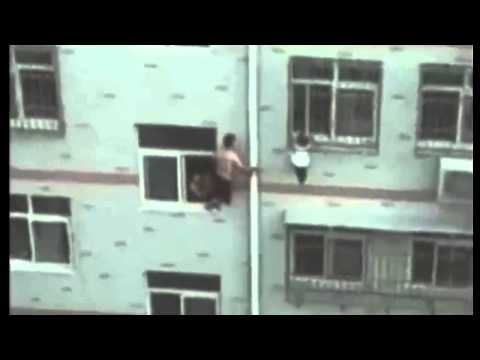 Footage: Man Uses Mop to Rescue Toddler Dangling from 4th Floor Window 