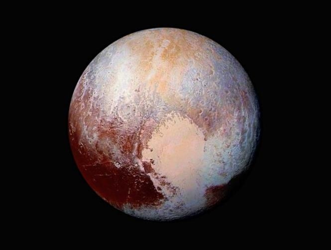 NASA Reveals: Pluto, A World of Blue Sky and Red Ice