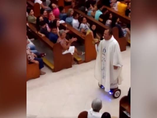 Footage: Priest Hoverboarding During Christmas Mass Suspended