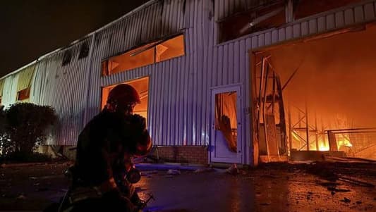 Ukraine emergency workers extinguish fire in grain warehouse in Odesa region