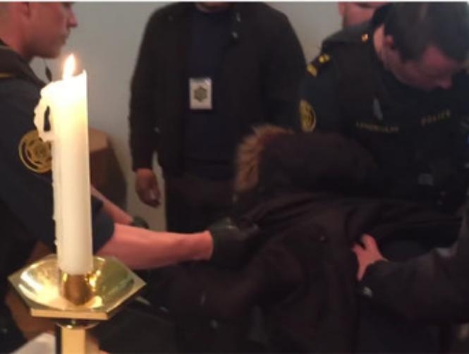 Watch: Police Officers Drag Asylum Seekers from Church