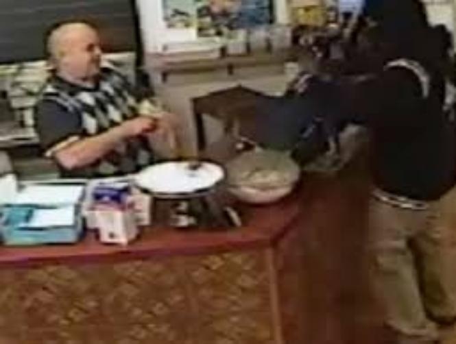 Watch: Shop Owner Stays Super Chill During An Armed Robbery