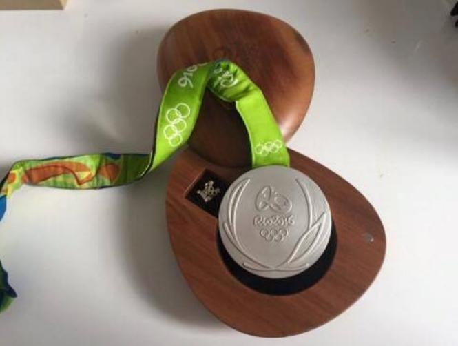 Olympian Sells Medal to Help Boy Battling Cancer