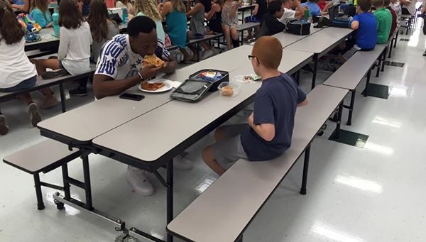 Boy With Autism Reunites With College Football Player From Viral Lunch Photo