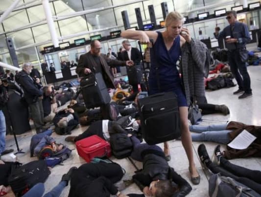 Protesters hold 'die-in' at Heathrow against airport expansion