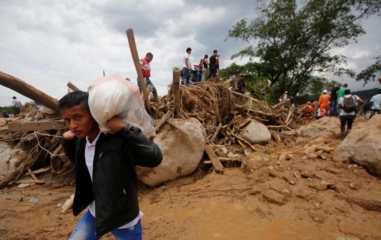 Photos: Rescuers, Locals Dig for Colombia Flood Victims, 254 Die