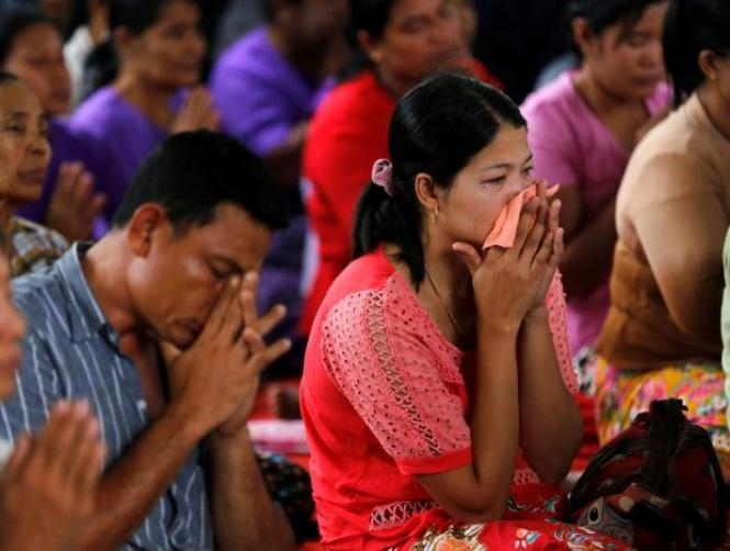 Myanmar cremates some of 31 bodies retrieved in missing plane disaster