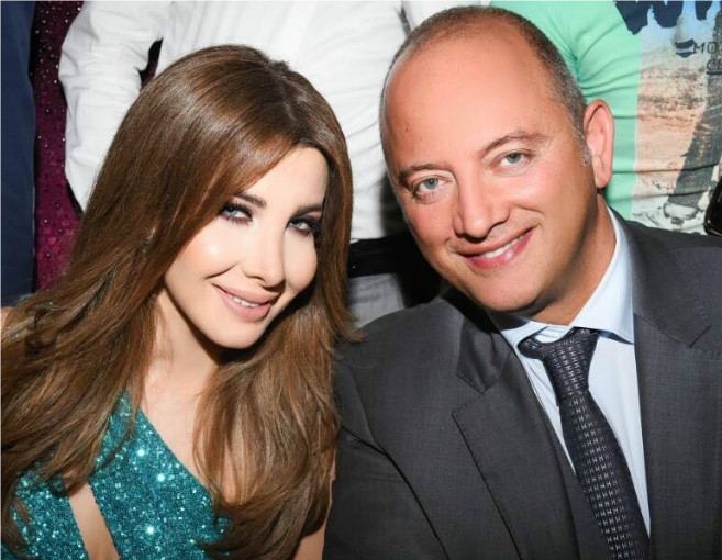 هكذا عايدت نانسي زوجها بعيد الأب