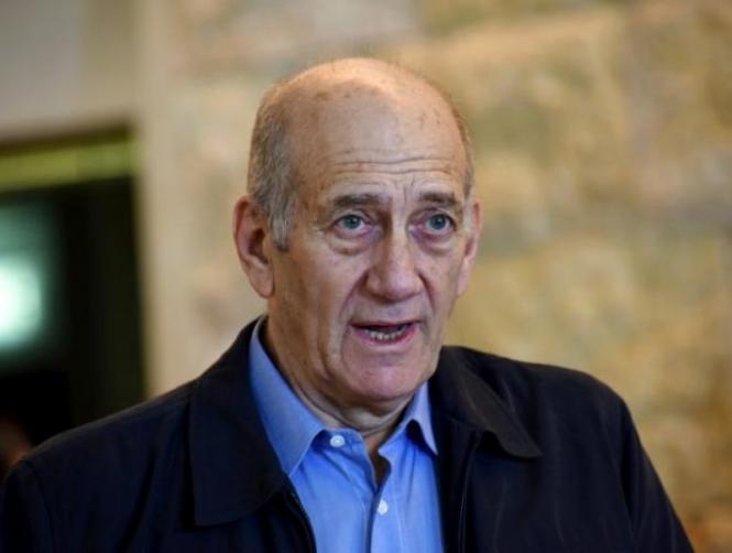 Former Israeli PM Olmert, 71, wins early release from prison