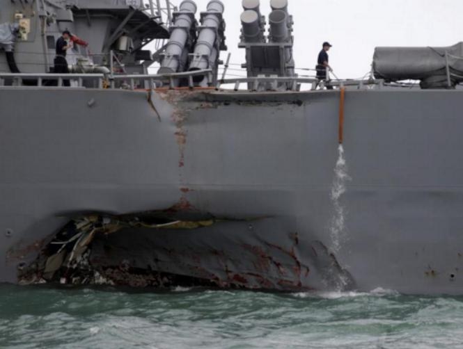 U.S. divers search for 10 missing sailors in hull of damaged destroyer