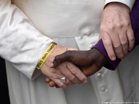 Pope wears refugee ID bracelet in appeal for help for migrants