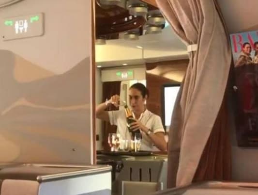 Emirates Flight Attendant Caught Pouring Champagne Back Into Bottle