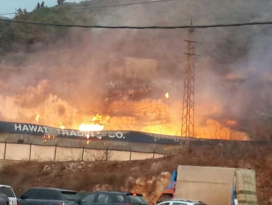 MTV correspondent: Civil Defense are currently trying to control the huge fire that erupted at a wood warehouse in Halat, no injuries reported