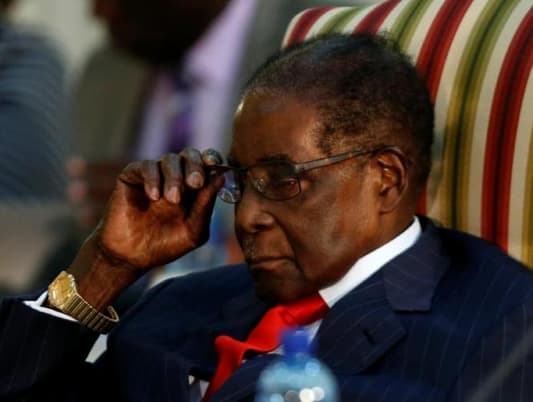 Critics urge WHO to reverse choice of Mugabe as goodwill envoy