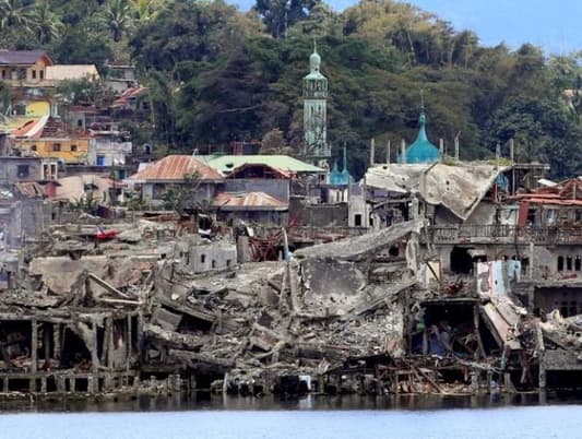 Families returning to ruined Philippine city taught to identify bombs