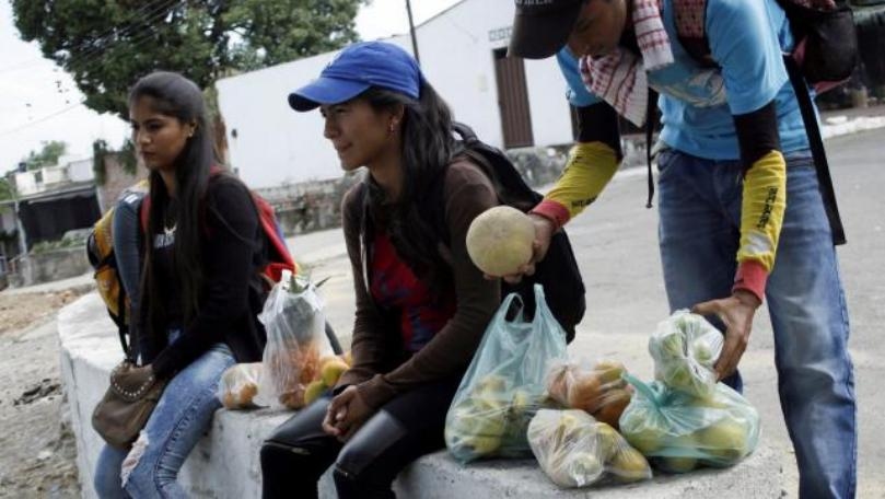 Desperate Venezuelans peddle wares door-to-door in Colombia to survive