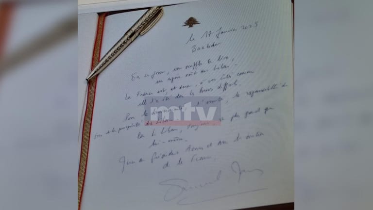 Photo: Macron Writes a Message of Hope in the Guestbook