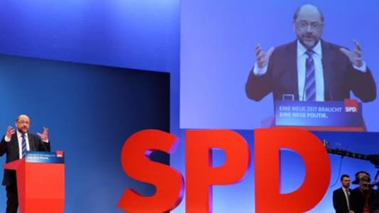 German SPD votes to pursue coalition talks with Merkel