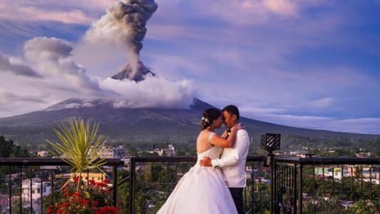 Volcano Erupts in Background of Stunning Wedding Photos