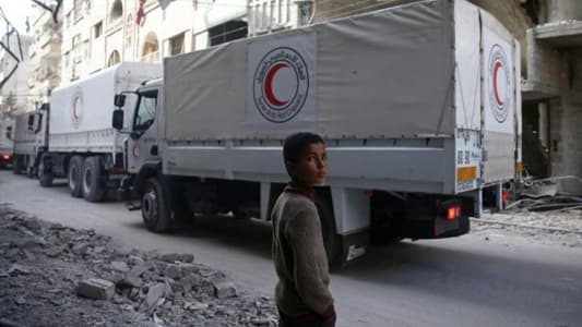 Aid convoy delivers food in Syria's besieged Ghouta despite bombardment