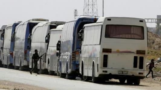 Biggest convoy yet leaves rebel pocket of Syria's Ghouta: state media