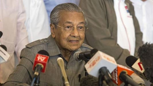 Malaysia's 92-year-old PM says he'll stay in office for one-two years