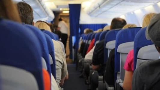 This Secret Button on Your Airplane Seat Will Instantly Give You More Space