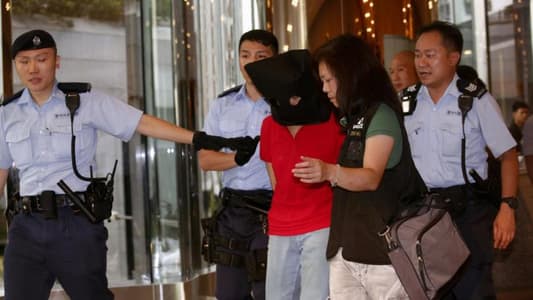 Four people wounded in rare Hong Kong shooting; woman arrested