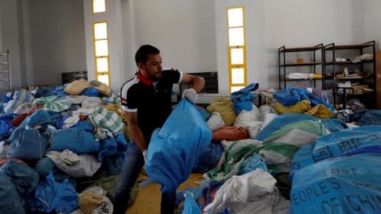 Eight years late, Palestinian mail arrives in West Bank