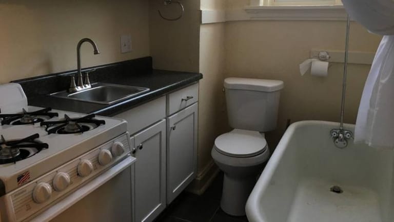 Somebody Actually Rented This Studio With a Toilet in Its Kitchen
