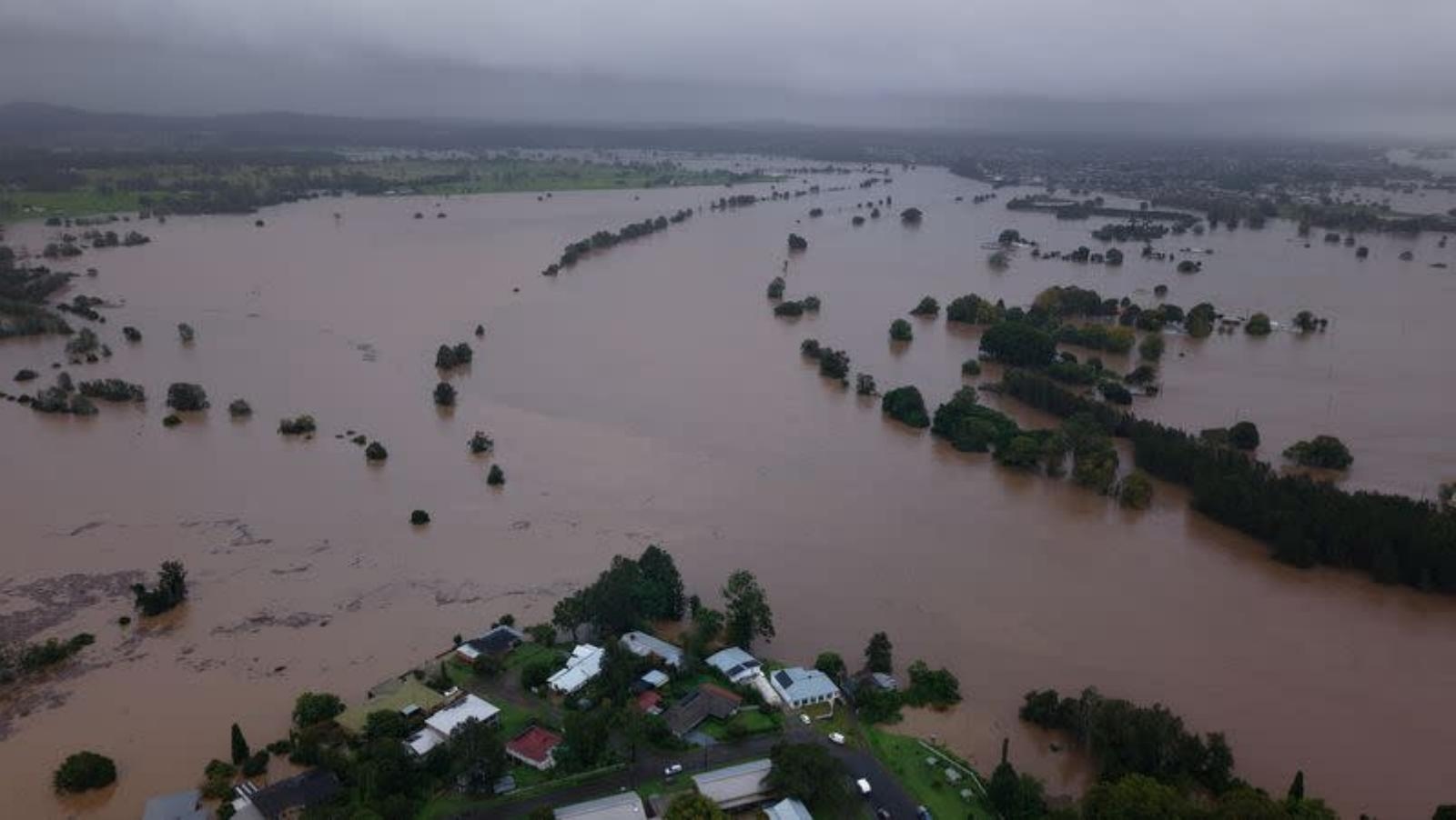 Torrential rain ravages Australian towns, thousands brace for isolation