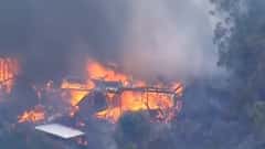 Watch: Fires Engulf Homes