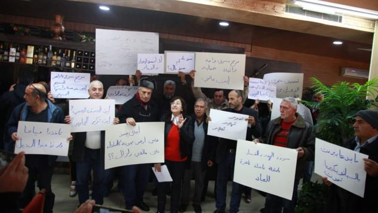 Residents protest against dam building alonside Bisri River