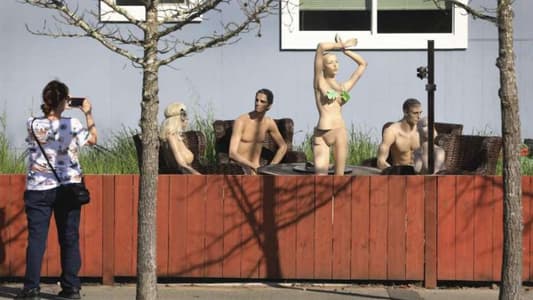 Man Fills Garden With Nude Mannequins After Neighbour Complains About Fence