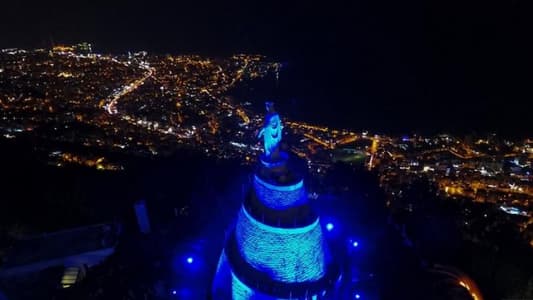 Lady of Lebanon Harissa lit up in blue on World Autism Day