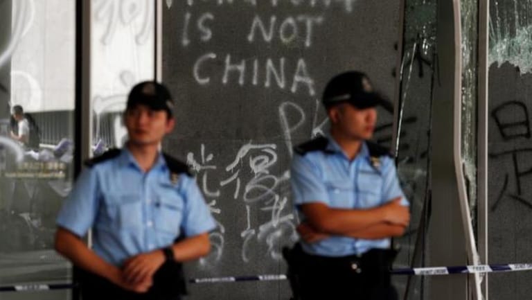 China denounces violent Hong Kong protests as 'undisguised challenge' to its rule