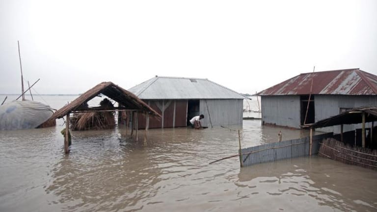 Bangladesh floods worsen after breach, death toll nears 100 in India