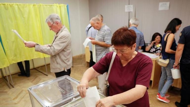 Zelenskiy's party in spotlight as Ukraine holds snap parliament election